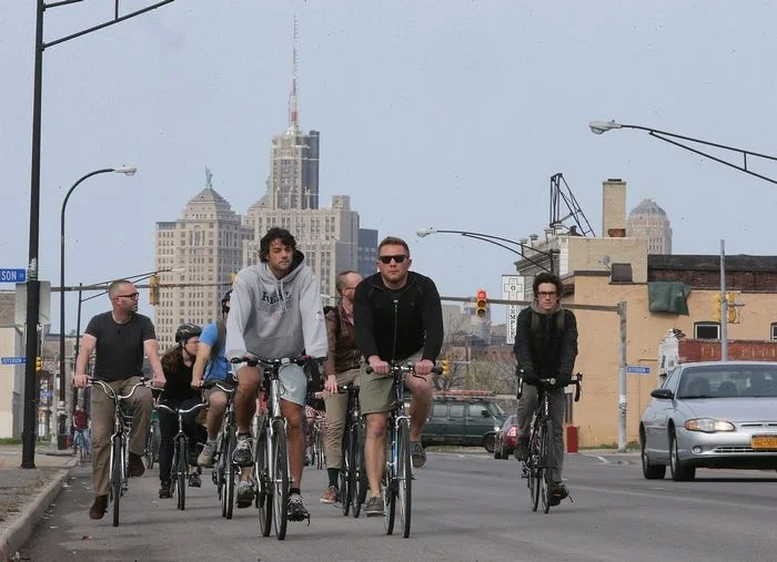 Riders head along Broadway in downtown Buffalo at the start of the “Tour de Neglect,” a bicycle tour of deteriorating Buffalo landmarks